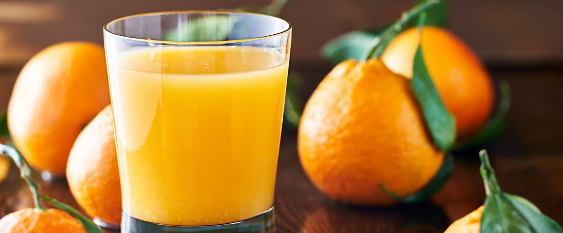 Oranges and a glass of fresh orange juice