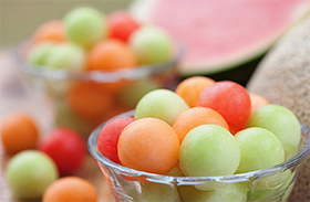 Melon balls in a glass bowl