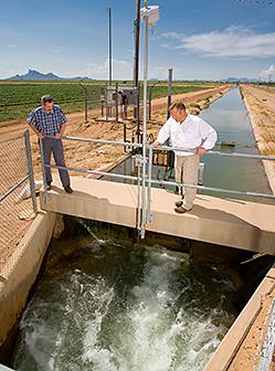 ARS engineers assess the automatic control of a hydraulic gate.