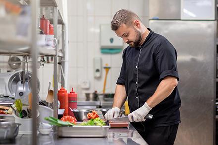 A chef preparing a meal. 