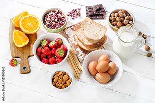 Foods often associated with food allergies including: eggs, dairy, nuts, strawberries and wheat.