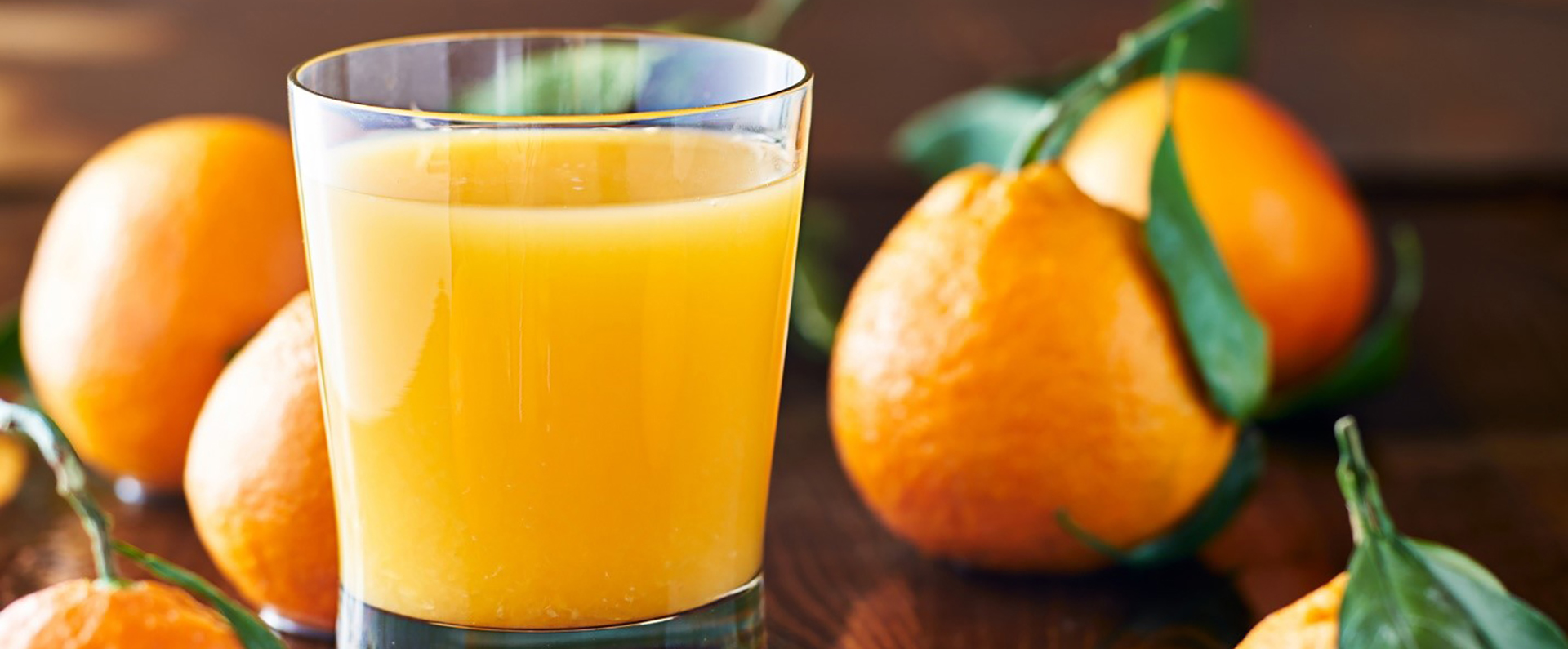 Oranges and a glass of fresh orange juice